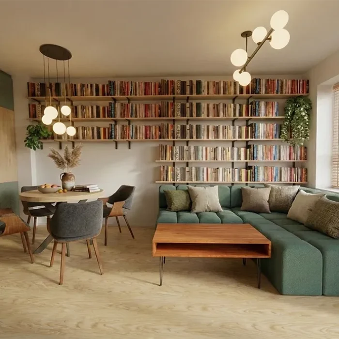 Salon z biblioteką na całą ścianę, zielona sofa i strefa jadalni, projekt wnętrz